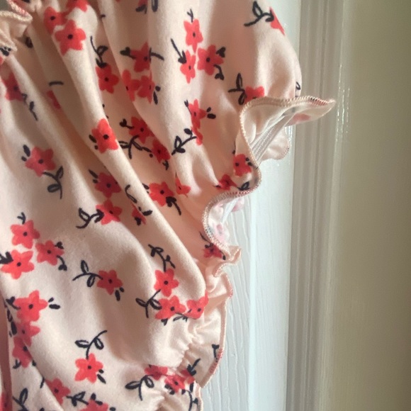 Pink mini dress with flowers all over. Size medium with a bow in the front. - Picture 6 of 10